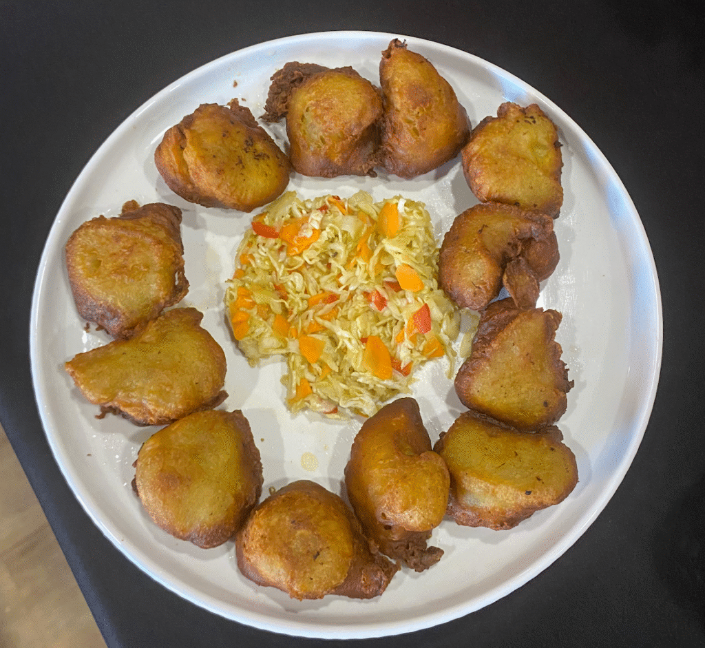 Platter of Haitian fritters with pikliz