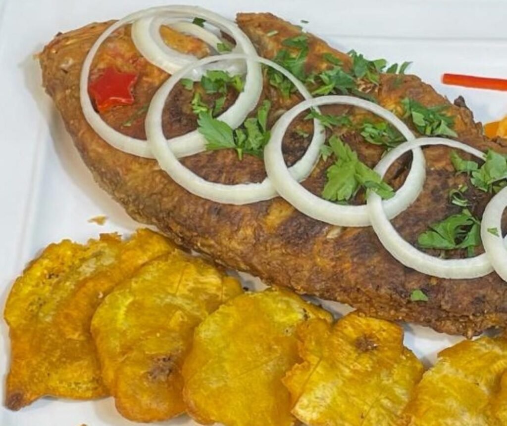 Whole fried fish with plantains